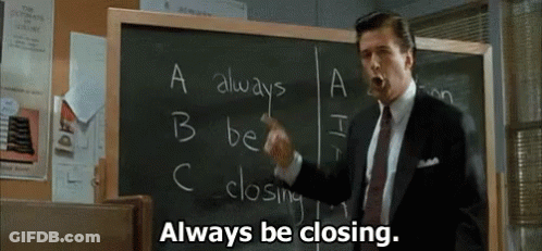 Man In Suit Pointing At Blackboard Saying Always Be Closing GIF
