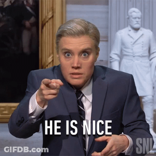 Man In Suit Pointing At Camera Saying He Is Nice GIF