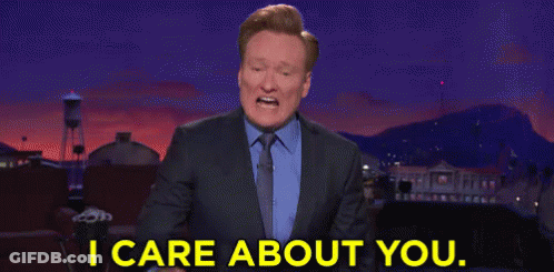 Man In Suit Pointing I Care About You GIF