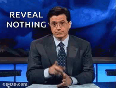 Man In Suit Pointing Saying Reveal Nothing GIF