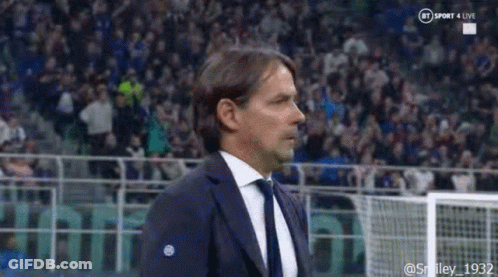 Man In Suit Raising Arms GIF