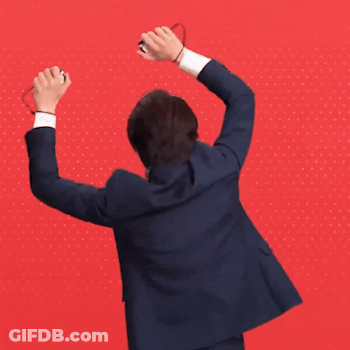 Man In Suit Raising Arms GIF