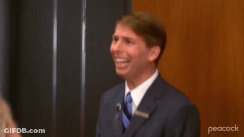 Man In Suit Raising Hands Saying It's A Lot GIF
