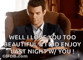 Man In Suit Reading Book Saying I Love You GIF