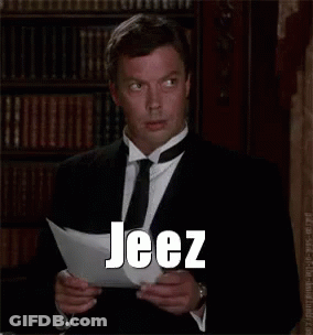 Man In Suit Reading Paper Saying Jeez GIF