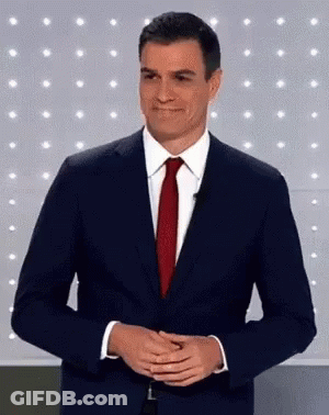 Man In Suit Red Tie Smiling Hands Folded GIF