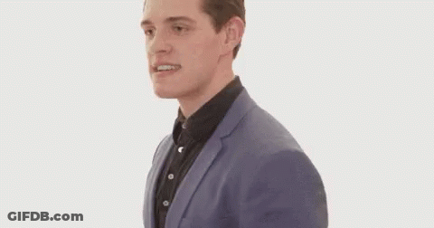 Man In Suit Running And Making Face GIF