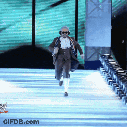 Man In Suit Running Down Runway GIF
