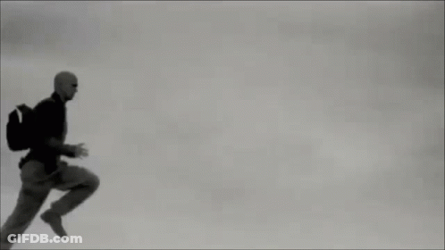 Man In Suit Running Through Air GIF