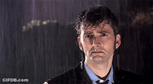 Man In Suit Sad In Rain GIF