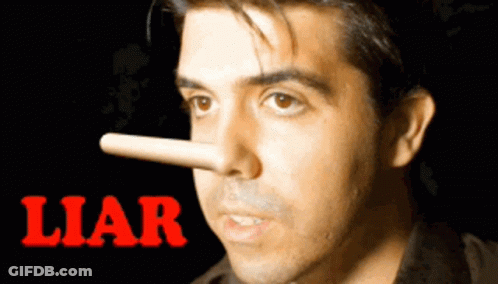 Man In Suit Saying A Liar's A Liar At Table GIF