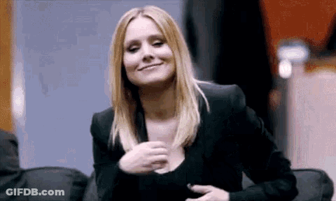 Man In Suit Saying Boom At Microphone GIF