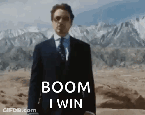 Man In Suit Saying Boom I Win In Desert GIF