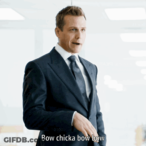 Man In Suit Saying Bow Chicka Bow Bow GIF