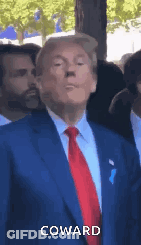 Man In Suit Saying Coward To Crowd GIF
