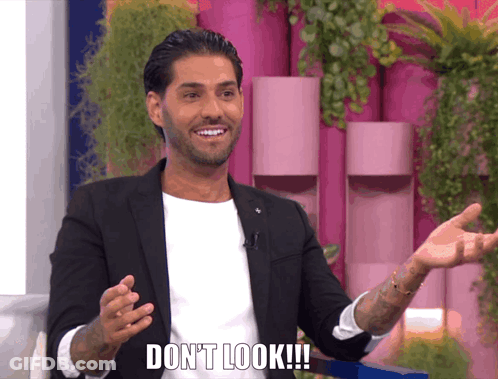 Man In Suit Saying Don't Look Arms Outstretched GIF