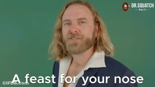Man In Suit Saying Feast For Your Nose GIF