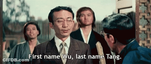 Man In Suit Saying First Name Wu Last Name Tang GIF