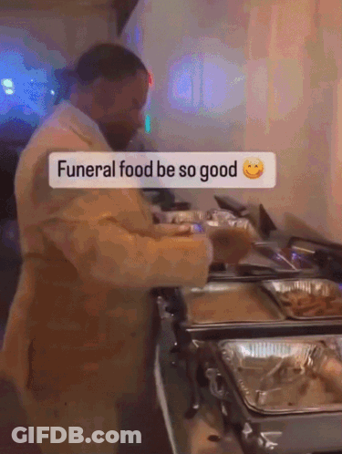 Man In Suit Saying Funeral Food Be So Good GIF