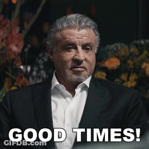 Man In Suit Saying Good Times With Flowers GIF