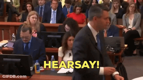 Man In Suit Saying Hearsay In Yellow Letters GIF