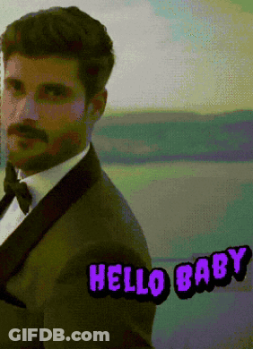 Man In Suit Saying Hello Baby In Purple GIF