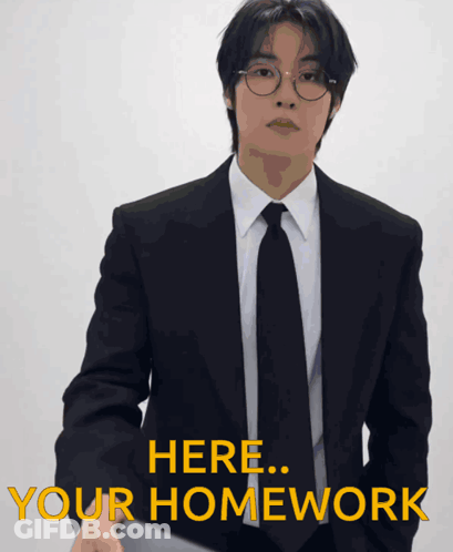 Man In Suit Saying Here Your Homework GIF
