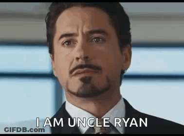 Man In Suit Saying I Am Uncle Ryan GIF