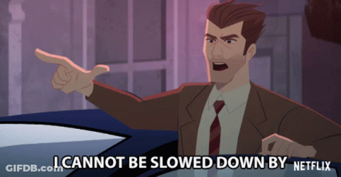 Man In Suit Saying I Cannot Be Slowed Down By Netflix While Pointing GIF