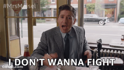 Man In Suit Saying I Don't Wanna Fight GIF