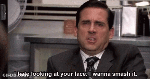 Man In Suit Saying I Hate Looking At Your Face GIF