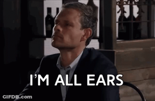 Man In Suit Saying I'm All Ears GIF