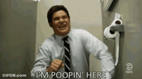Man In Suit Saying I'm Poopin Here Next To Toilet Paper GIF