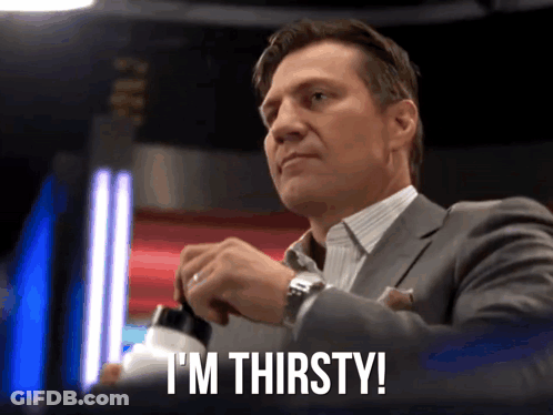 Man In Suit Saying I'm Thirsty Opening Bottle GIF