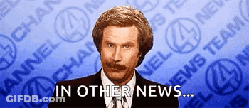 Man In Suit Saying In Other News GIF
