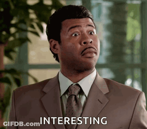 Man In Suit Saying Interesting GIF