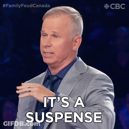 Man In Suit Saying It's A Suspense GIF