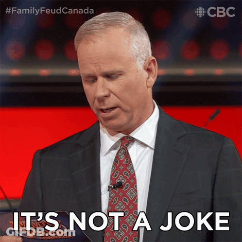 Man In Suit Saying It's Not A Joke Holding Paper GIF