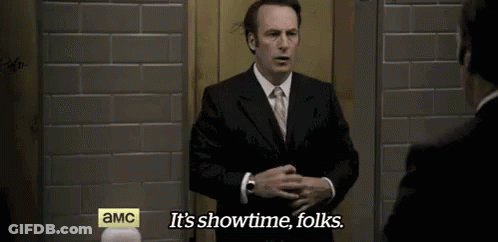 Man In Suit Saying It's Showtime Folks GIF