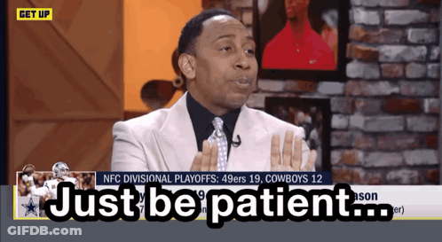 Man In Suit Saying Just Be Patient On TV Screen GIF