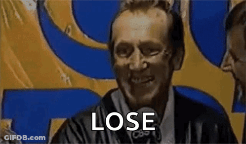 Man In Suit Saying Lose In Front Of Yellow And Blue Sign GIF