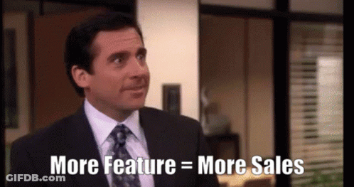 Man In Suit Saying More Feature Equals More Sales GIF