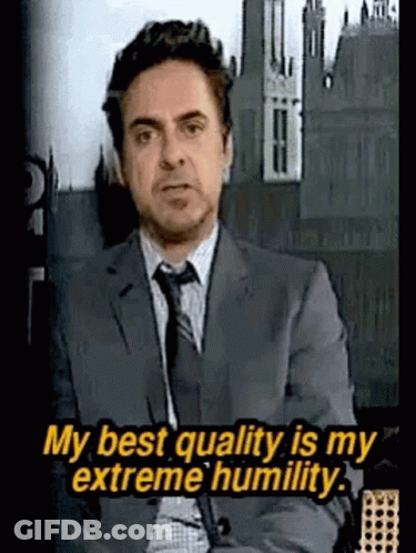 Man In Suit Saying My Best Quality Is My Extreme Humility GIF