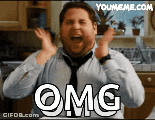 Man In Suit Saying Oh My God On Couch GIF