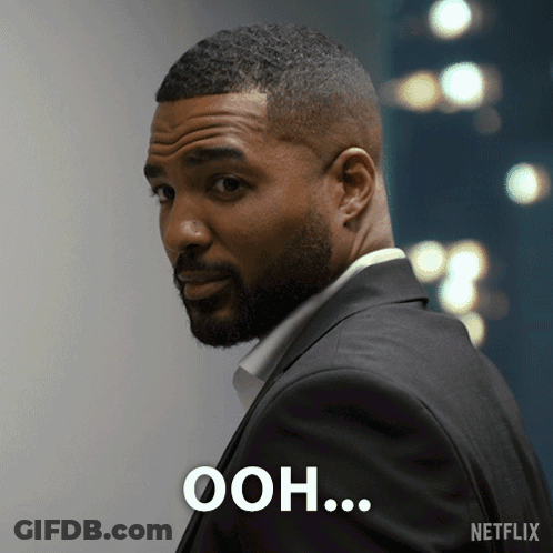 Man In Suit Saying Ooh GIF