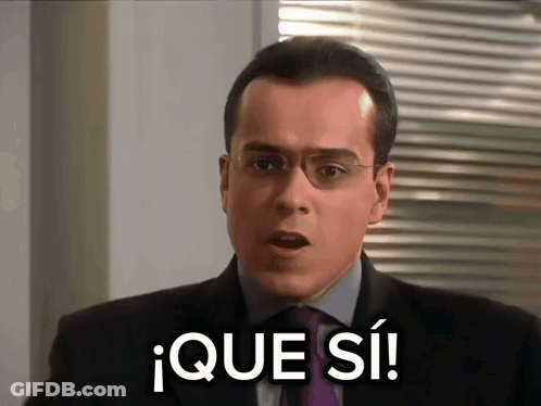 Man In Suit Saying Que Si GIF