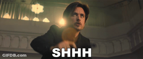 Man In Suit Saying Shhh GIF