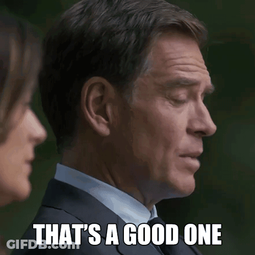 Man In Suit Saying That's A Good One To Woman GIF