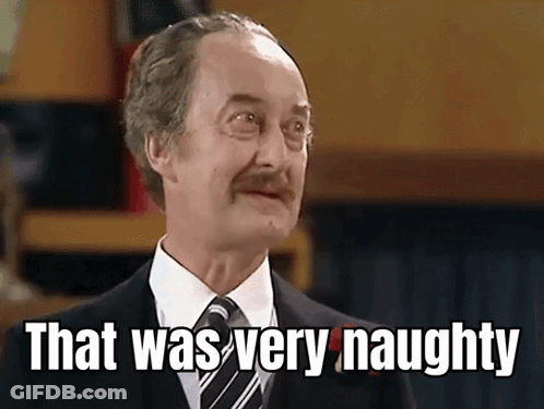 Man In Suit Saying That Was Very Naughty GIF