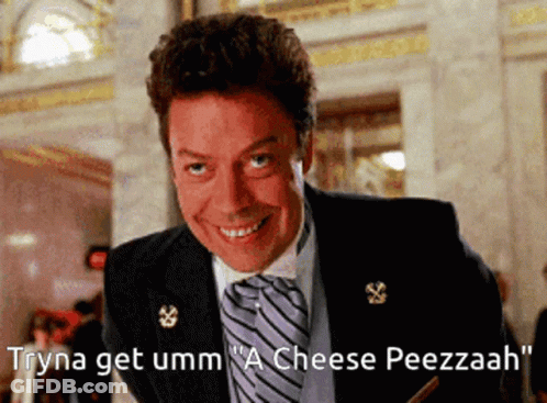 Man In Suit Saying Tryna Get Umm A Cheese Peezzaah GIF